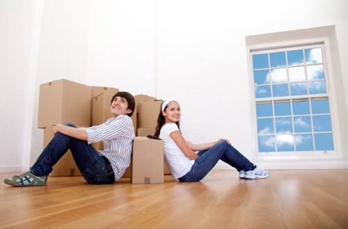 Relocation team loading office furniture for transport in North End