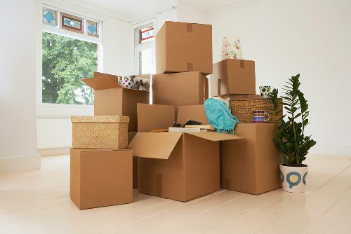 Small flat move and boxed belongings being loaded into a van
